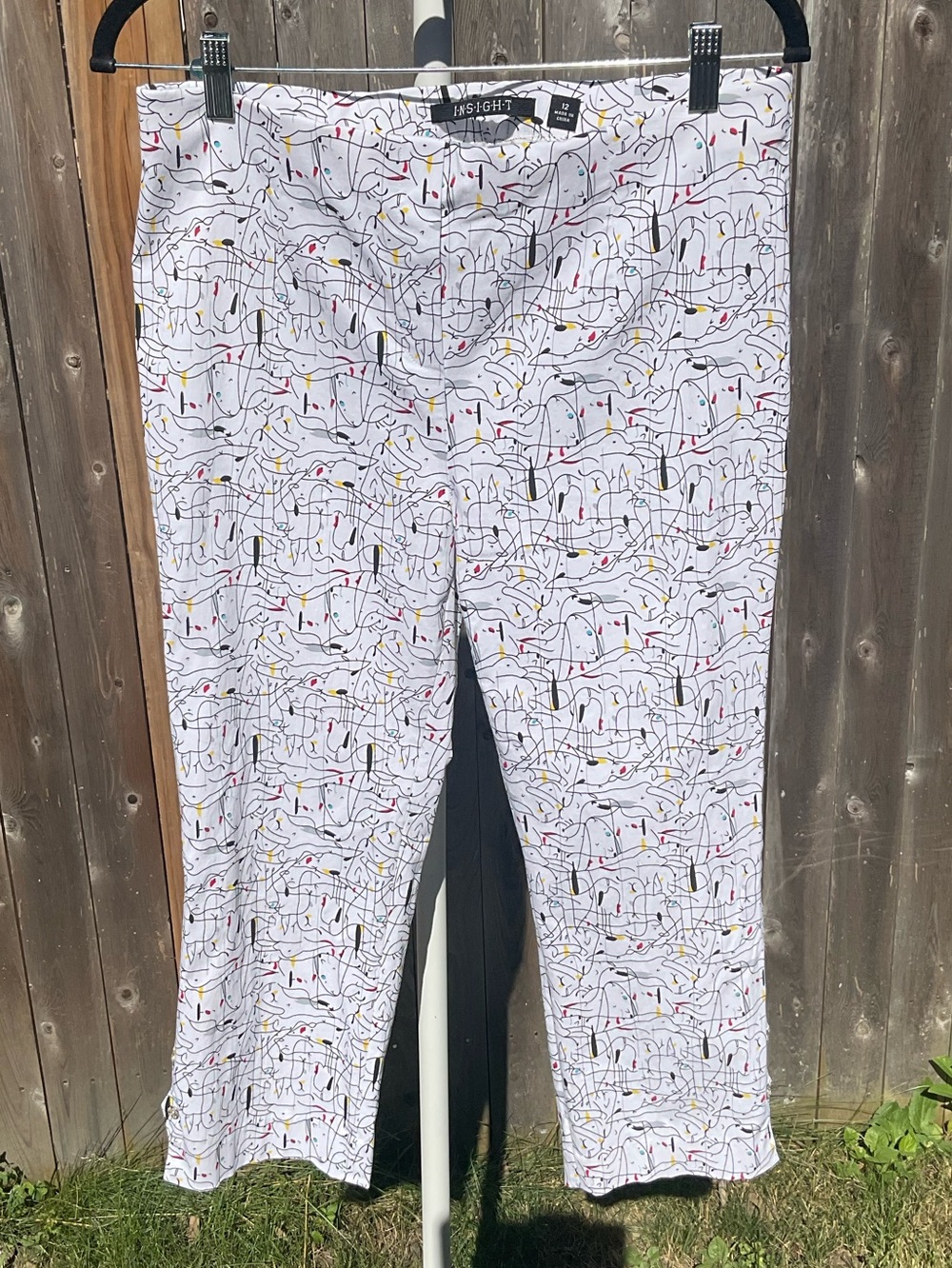 Insight White Capris with Black, Red & Yellow Art Print